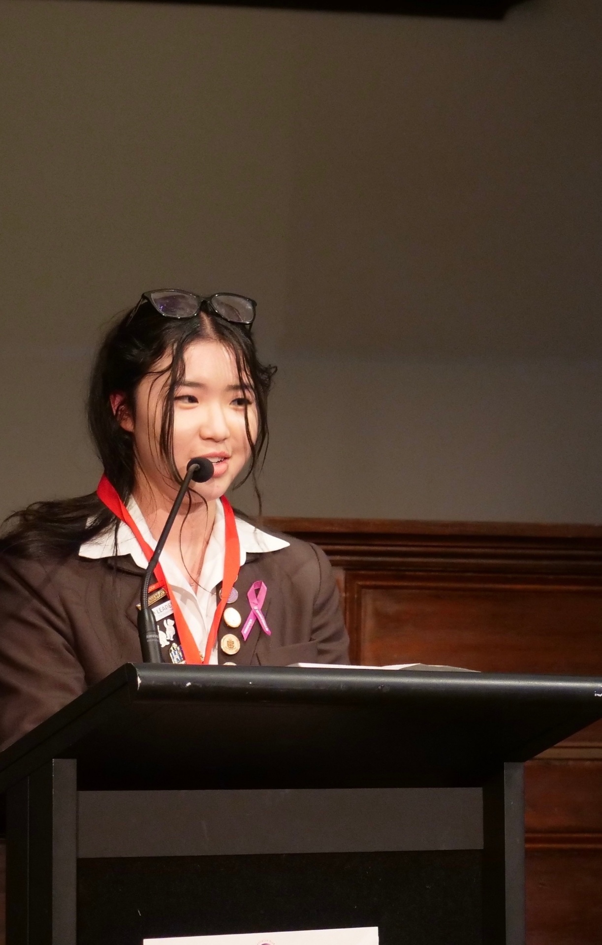 Veronica speaking at a podium
