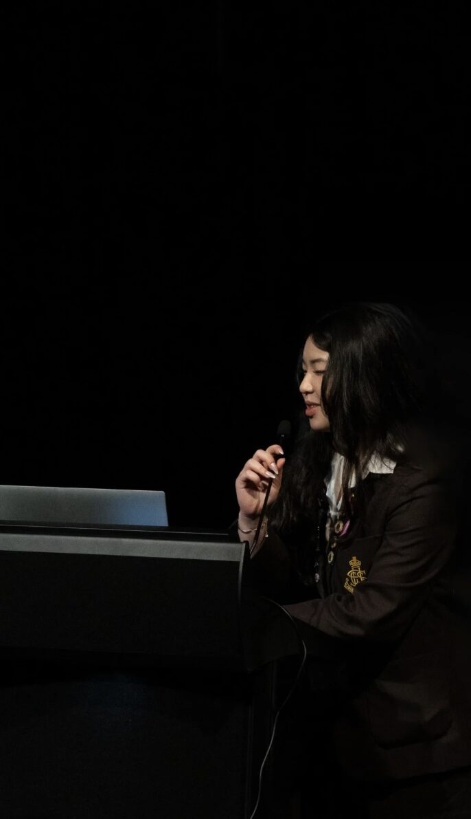 Speaking at a podium
